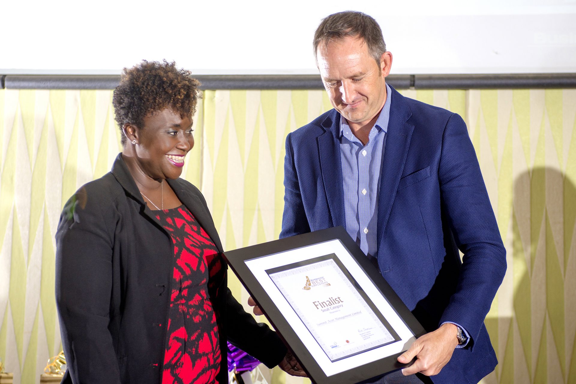 Valerie Hope presenting John Howard at Summit with a Certificate as one of the Finalist in the Small category